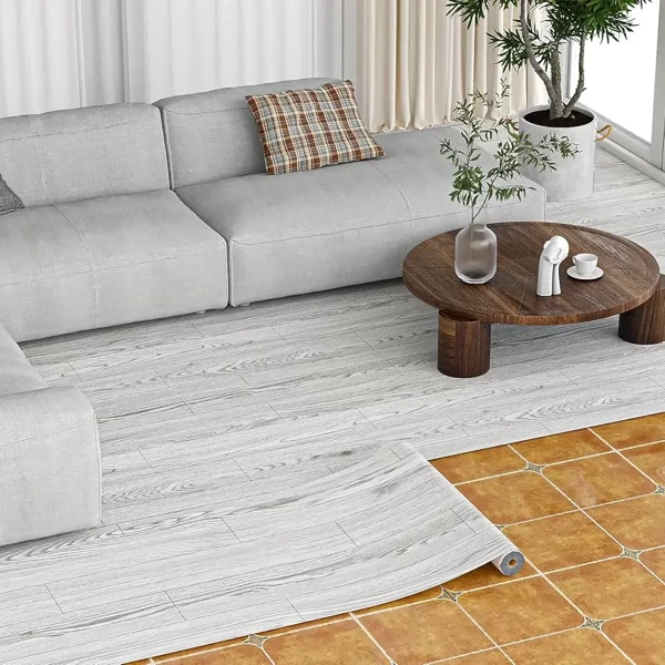 Light grey wood-pattern vinyl roll flooring in living room