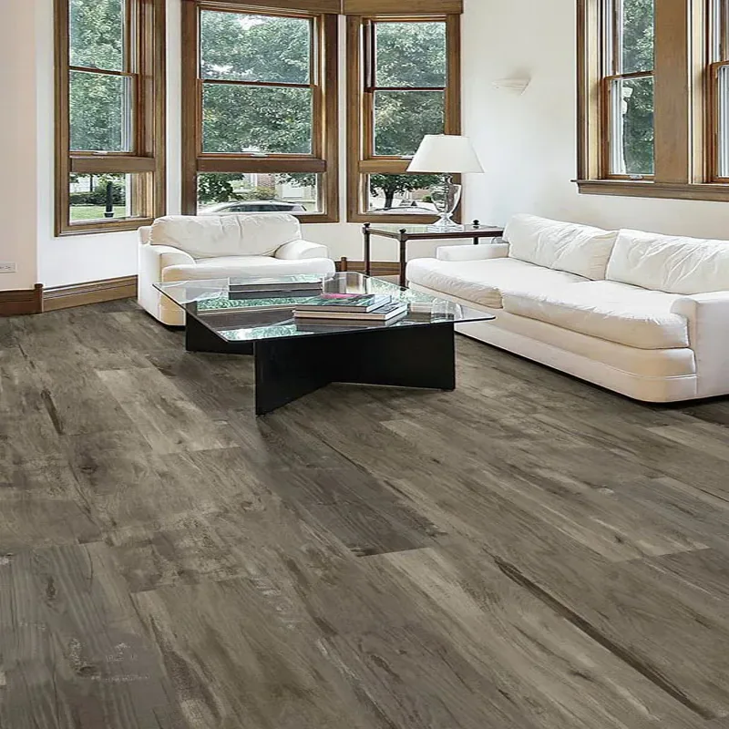 Grey weathered oak planks in a bedroom setting highlighting spc wood plank flooring benefits for quiet, comfortable living spaces