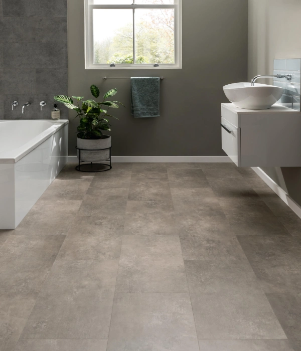 bathroom interior featuring grey stone-texture LVT flooring tiles