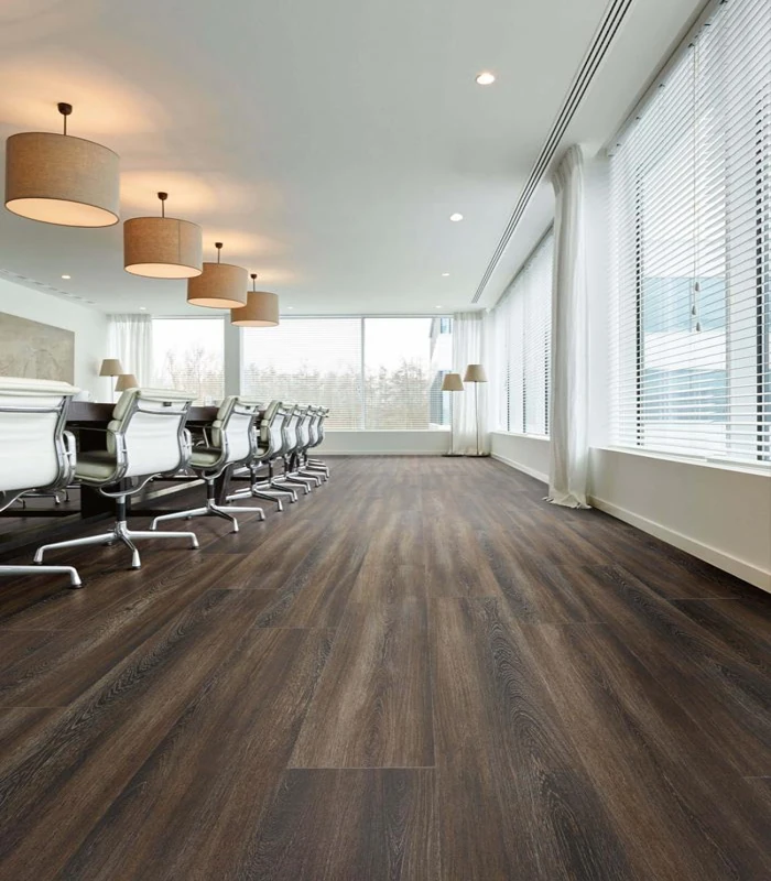 Wide-plank walnut spc flooring in office providing a sophisticated and waterproof surface