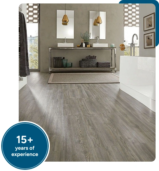 grey wood-look LVT flooring with durable luxury vinyl planks and a contemporary vanity